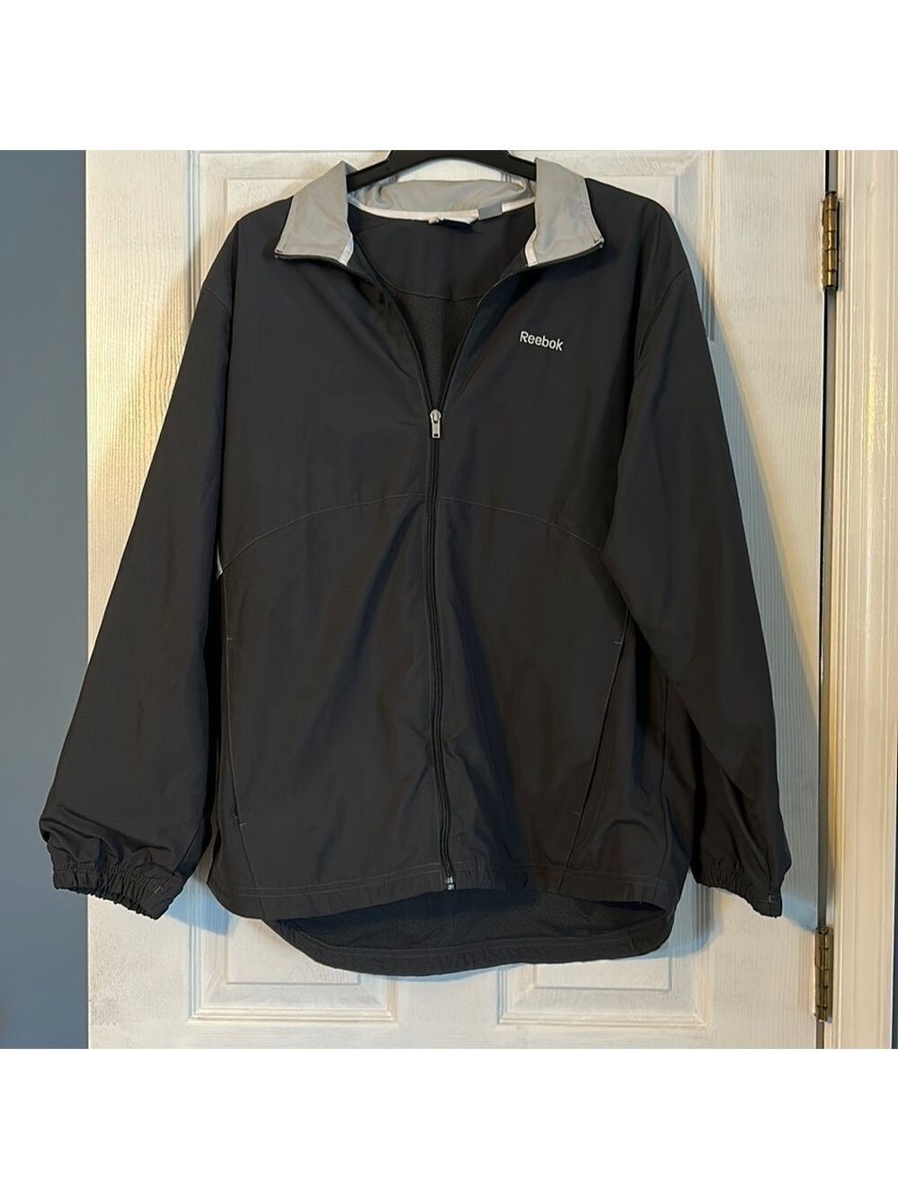 REEBOK men’s windbreaker jacket; size large